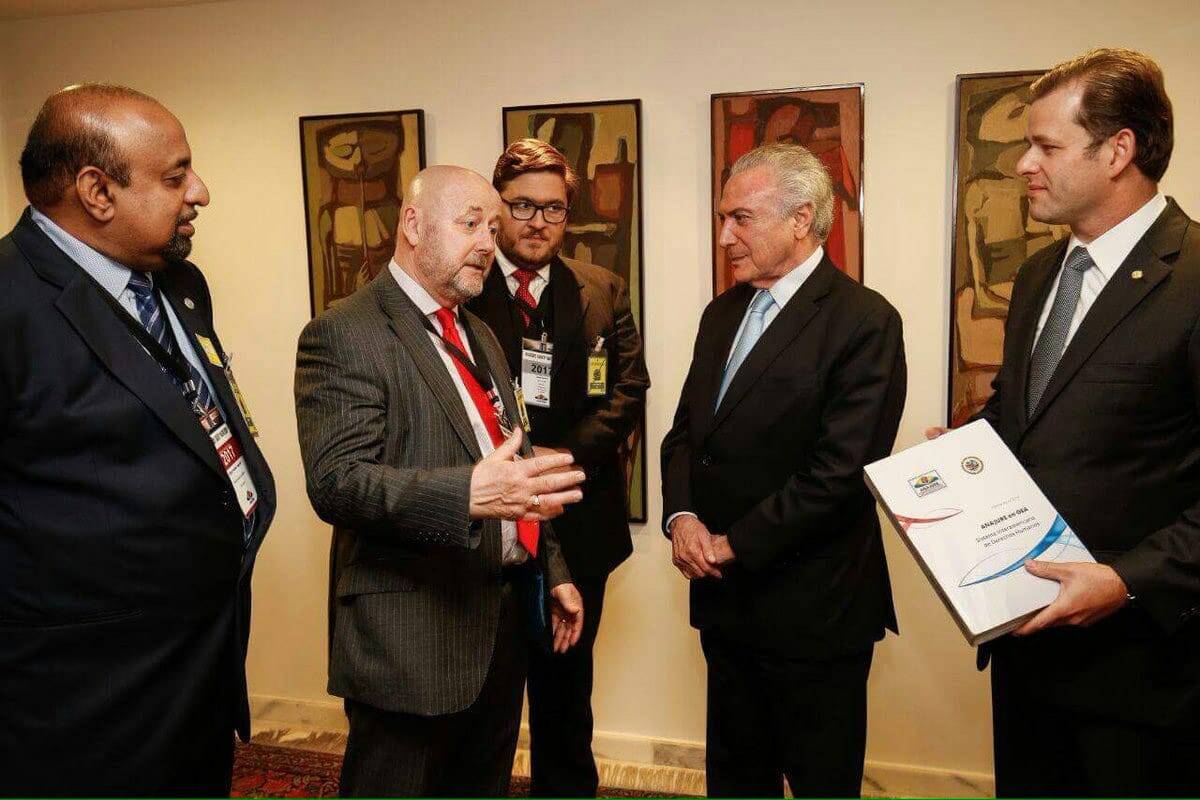 RLP Chairman, Mervyn Thomas, talking with former President of Brazil, Michel Temer. as RLP Leadership Team member Godfrey Yogarajah (far left) looks on. The RLP held its 2017 Consultation in Brasilia.